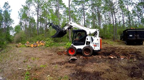 harvesting logs with a skid steer|How to Move Logs with a Skid Steer Cat 259D .